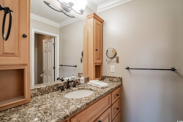 bathroom with vanity and ornamental molding