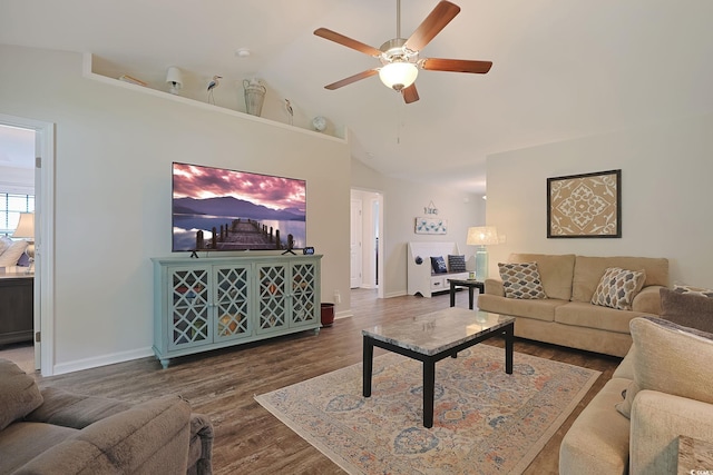 living room with ceiling fan, dark wood-type flooring, and high vaulted ceiling