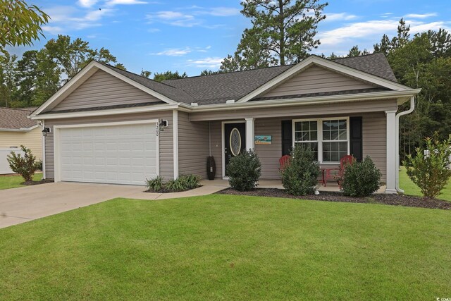 view of front of home featuring a front lawn, a porch, and a garage