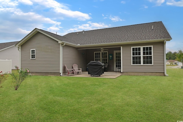 rear view of house featuring a patio, ceiling fan, and a yard