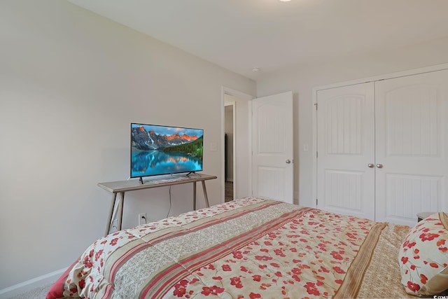 carpeted bedroom featuring a closet