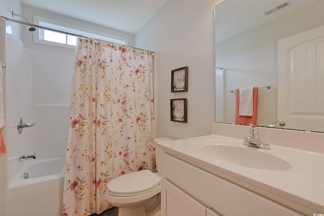 full bathroom featuring shower / bathtub combination with curtain, vanity, and toilet