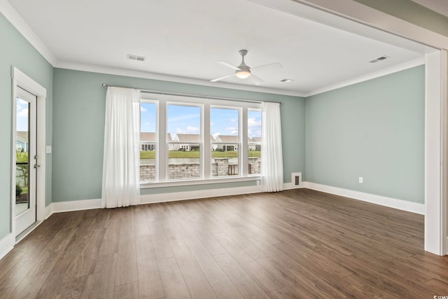 empty room featuring ornamental molding, ceiling fan, and dark hardwood / wood-style floors