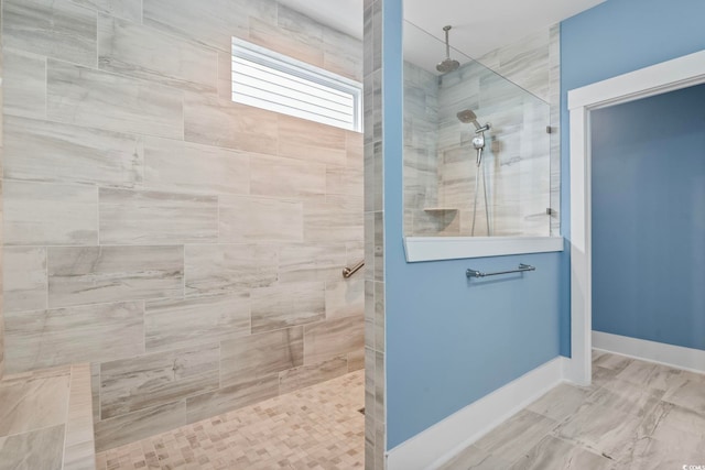 bathroom with a tile shower