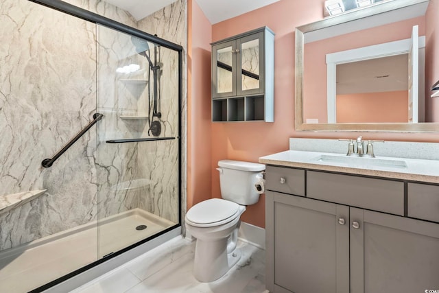 bathroom with walk in shower, vanity, and toilet