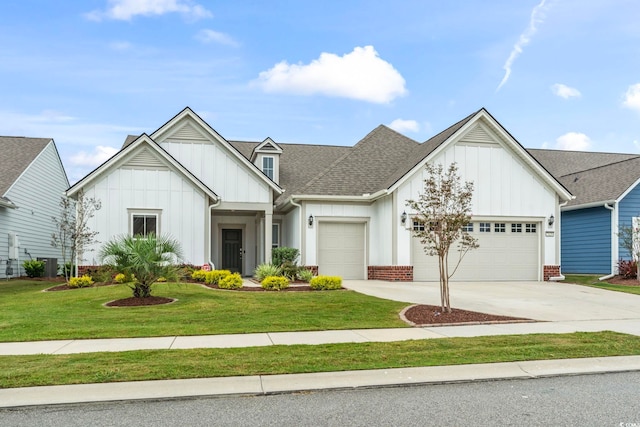 view of front of home featuring a front yard and a garage