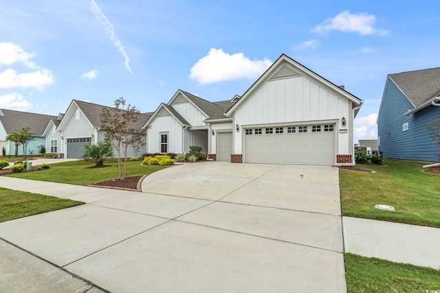 modern farmhouse featuring board and batten siding, an attached garage, and a front lawn