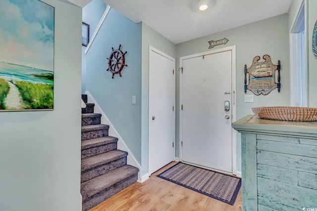 foyer with light hardwood / wood-style floors