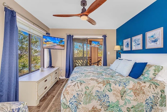 bedroom featuring ceiling fan, light hardwood / wood-style floors, and access to outside