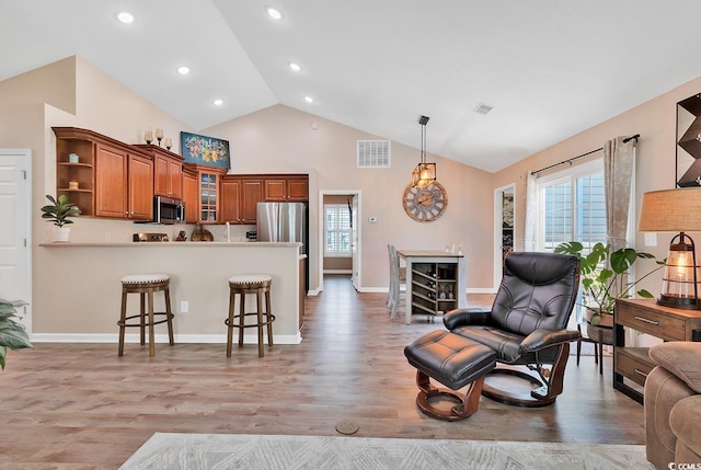3154 Shorecrest Bay Dr, Murrells Inlet, SC 29576 - living area with visible vents, a wealth of natural light, high vaulted ceiling, and light wood-type flooring