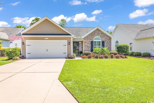 view of front of home featuring a front yard and a garage