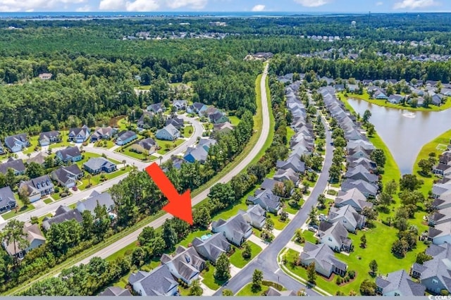 birds eye view of property featuring a water view