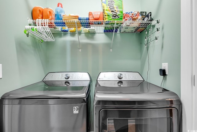 washroom with independent washer and dryer