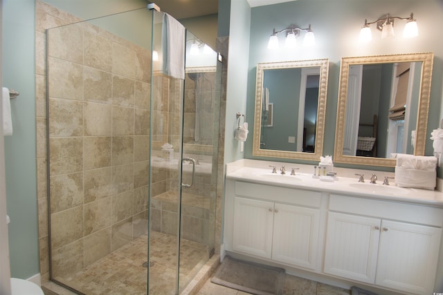 bathroom with walk in shower and vanity