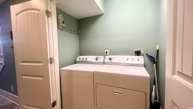 clothes washing area with washer and dryer