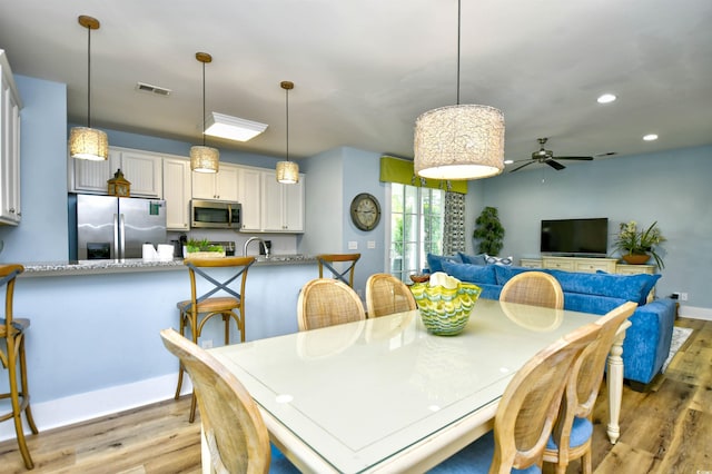 4808 Cantor Ct, North Myrtle Beach, SC 29582 - dining room with light wood finished floors, a ceiling fan, recessed lighting, and baseboards