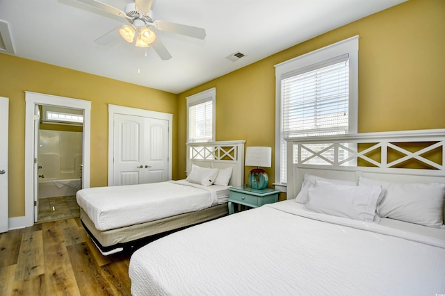 4808 Cantor Ct, North Myrtle Beach, SC 29582 - bedroom featuring wood finished floors, a closet, ensuite bath, and ceiling fan