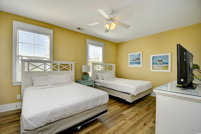 4808 Cantor Ct, North Myrtle Beach, SC 29582 - bedroom with light wood-style flooring, baseboards, and ceiling fan