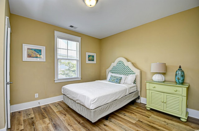 4808 Cantor Ct, North Myrtle Beach, SC 29582 - bedroom featuring baseboards and wood finished floors