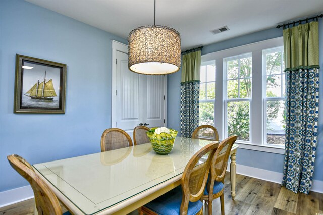 4808 Cantor Ct, North Myrtle Beach, SC 29582 - dining area with plenty of natural light, baseboards, and wood finished floors