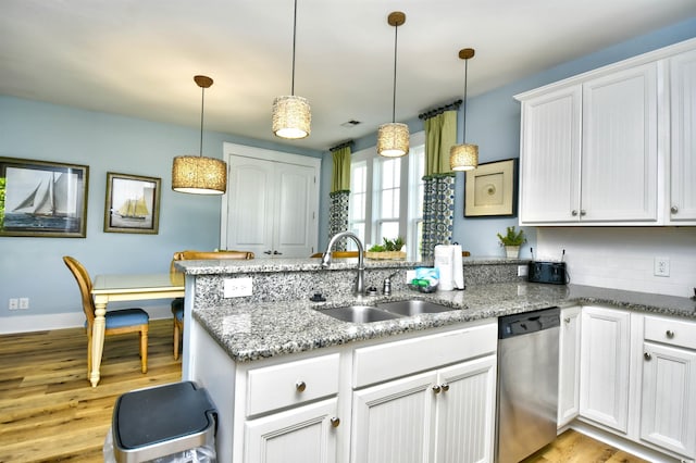 4808 Cantor Ct, North Myrtle Beach, SC 29582 - kitchen with dishwasher, a sink, a peninsula, light wood-style floors, and white cabinets