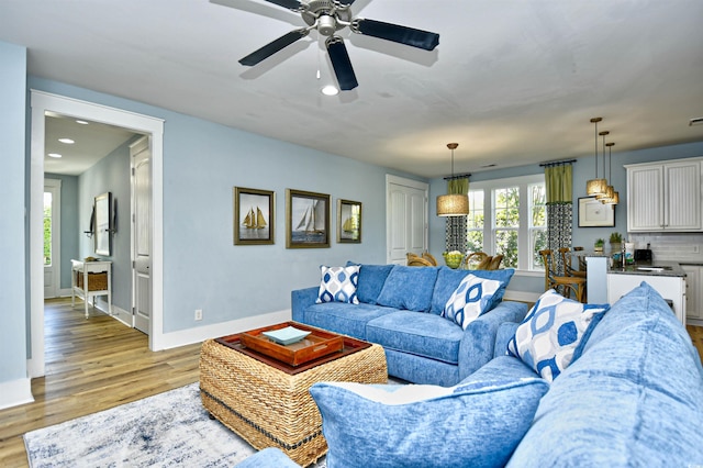 4808 Cantor Ct, North Myrtle Beach, SC 29582 - living room featuring baseboards, recessed lighting, light wood finished floors, plenty of natural light, and a ceiling fan