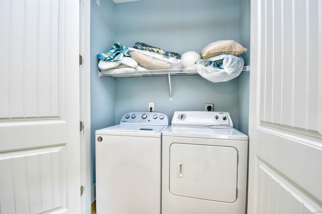 washroom featuring washer and dryer