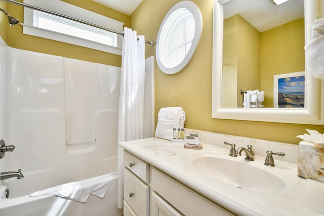 bathroom featuring vanity and shower / tub combo with curtain