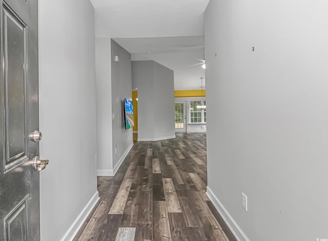 hall with french doors, dark hardwood / wood-style flooring, and lofted ceiling