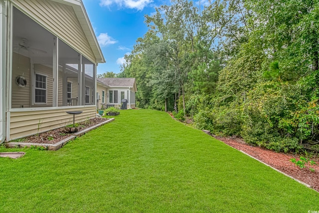 view of yard featuring a sunroom