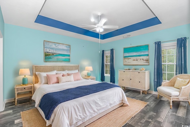 bedroom with ceiling fan and dark wood-type flooring