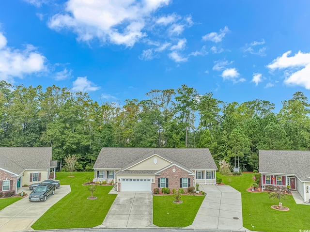 view of front of house featuring a front lawn and a garage