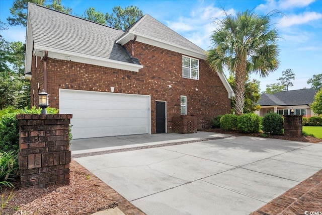 view of side of property with a garage