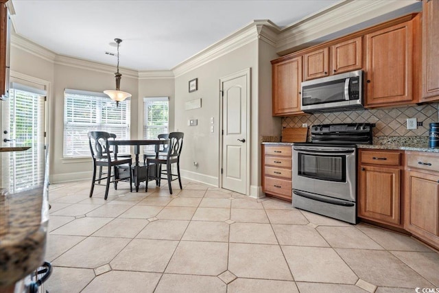 kitchen featuring appliances with stainless steel finishes, decorative backsplash, light stone countertops, pendant lighting, and crown molding