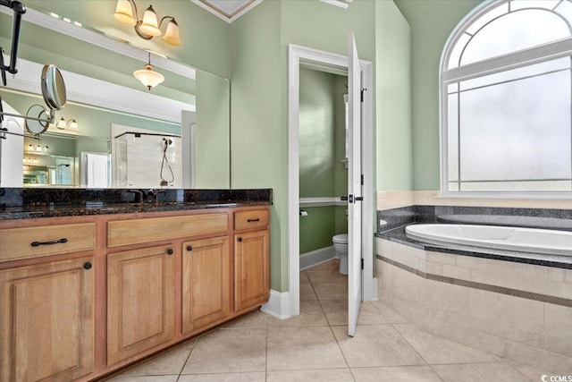 full bathroom with vanity, tile patterned flooring, ornamental molding, shower with separate bathtub, and toilet