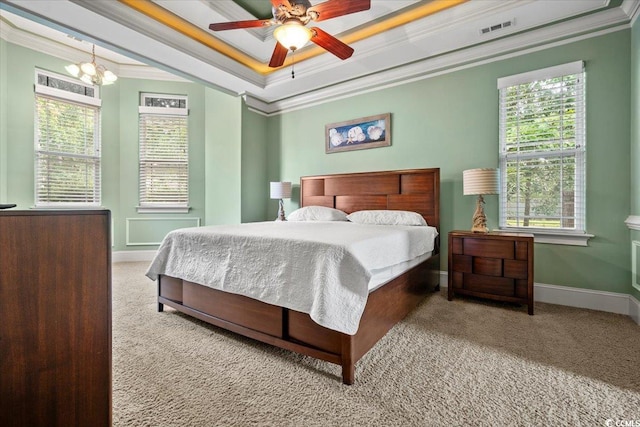 bedroom with crown molding, ceiling fan with notable chandelier, and light colored carpet