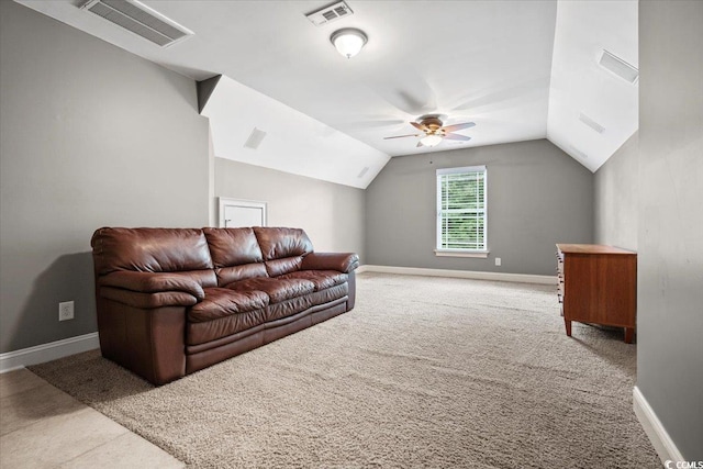 living room featuring ceiling fan, light colored carpet, and lofted ceiling