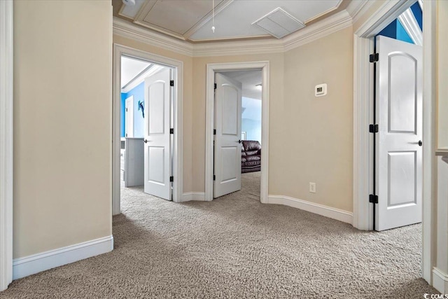 hall with carpet floors and ornamental molding