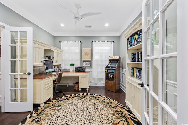 office featuring ceiling fan, french doors, built in desk, crown molding, and dark hardwood / wood-style flooring