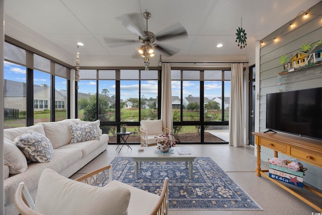 interior space featuring ceiling fan and plenty of natural light