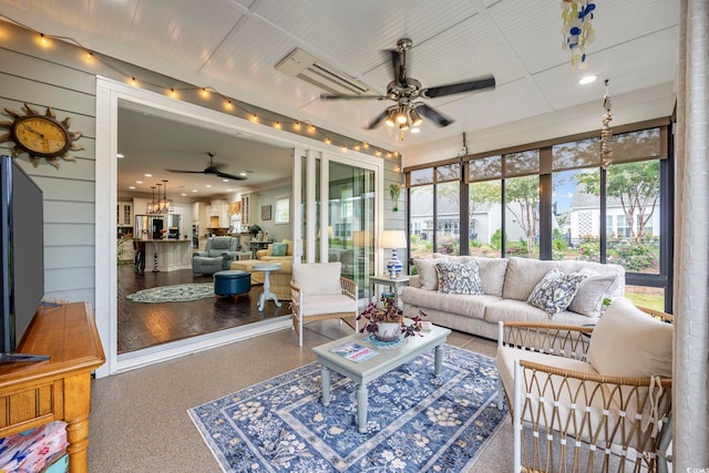 sunroom featuring ceiling fan