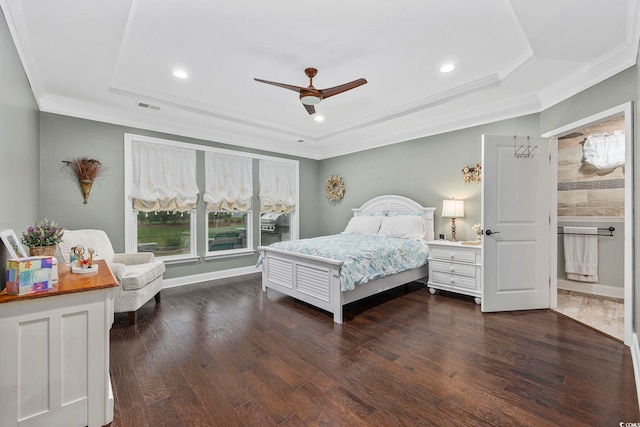 bedroom with ceiling fan, a raised ceiling, dark hardwood / wood-style floors, and crown molding