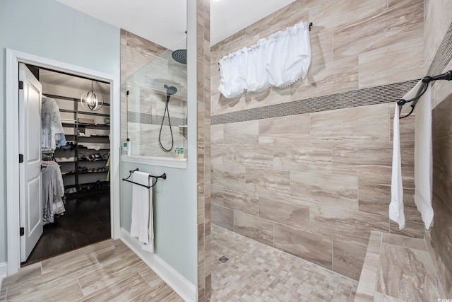 bathroom with tiled shower