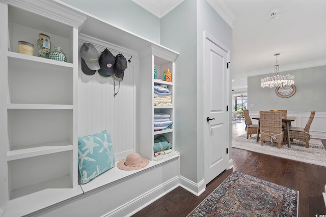 mudroom with ornamental molding, a notable chandelier, and dark hardwood / wood-style flooring