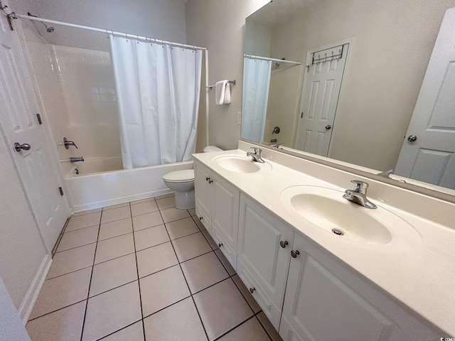 full bathroom featuring shower / bath combination with curtain, tile patterned floors, vanity, and toilet