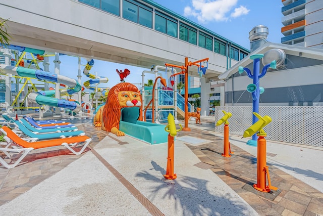 view of jungle gym with a patio