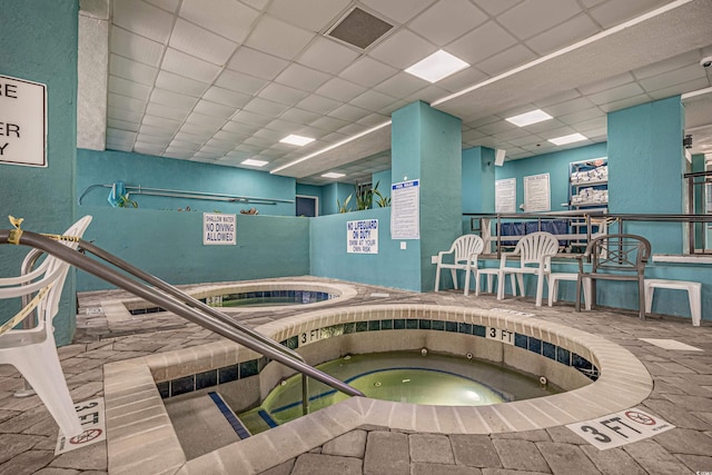 view of swimming pool featuring an indoor in ground hot tub