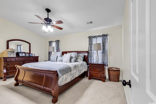 bedroom with ceiling fan and light colored carpet