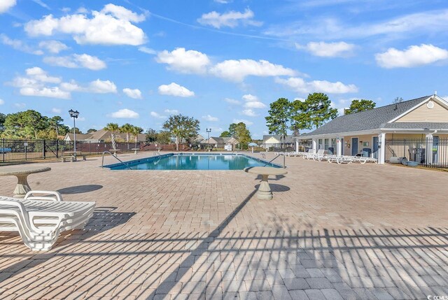 view of pool featuring a patio