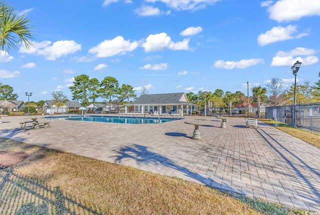 view of swimming pool with a patio